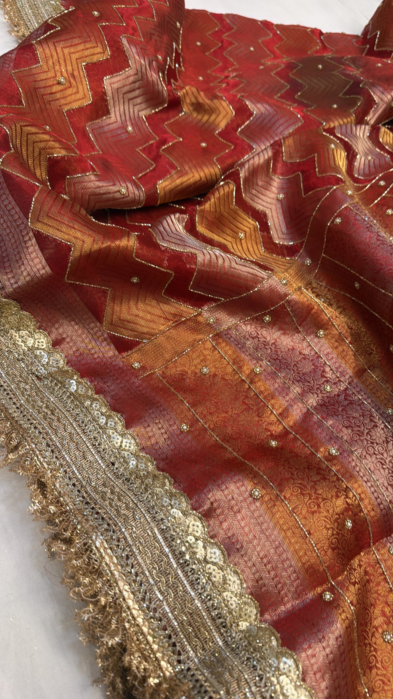 Tomato red husn tissue silk hand embroidered kadhwa saree